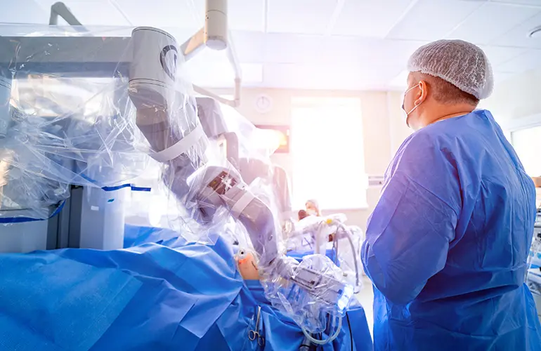 A robotic surgery system in a hospital operating room.